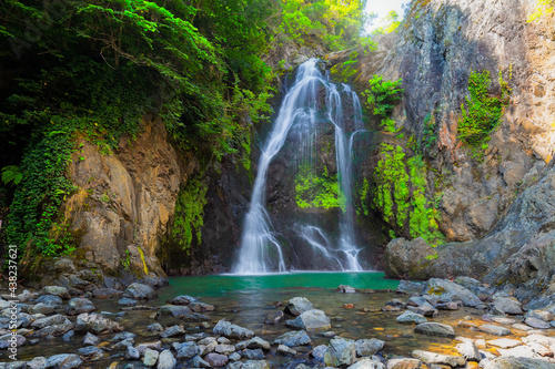 It s autumn time. Beautiful waterfall streams and colorful leaves. 