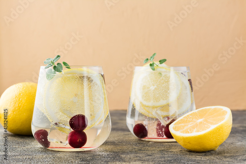 Canvas-taulu Summer refreshing cold cocktail with lemon and cherry - hard seltzer in glasses