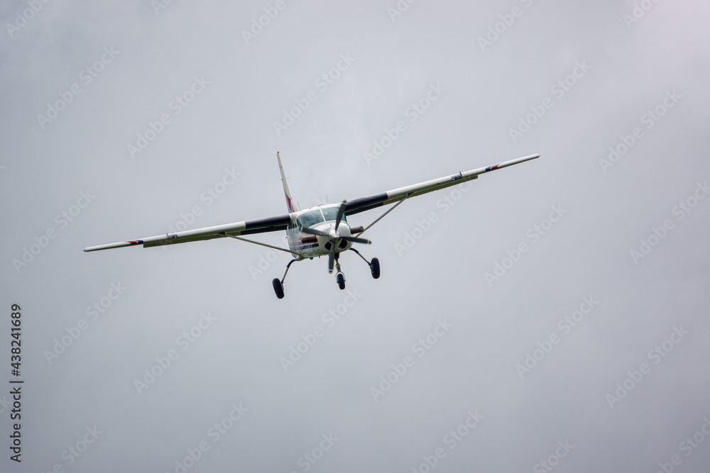 Fototapeta premium light aircraft returning to land after dropping the parachute display team on a practice jump 