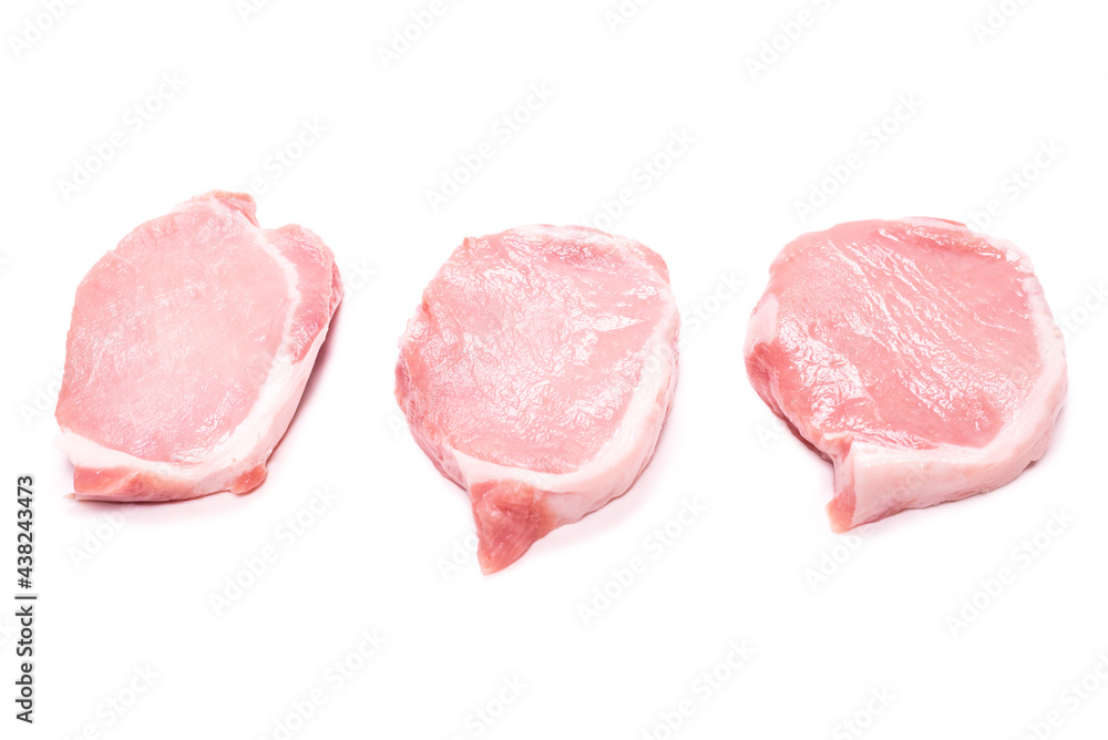 Raw pork pieces isolated on a white background.