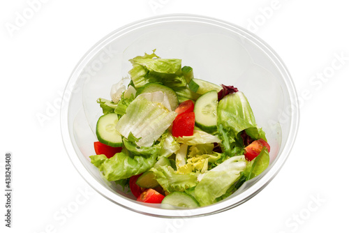 Salad with fresh vegetables isolated on a white background.