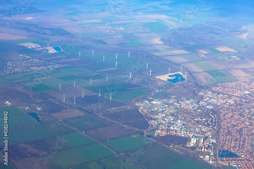 Mosonmagyarovar town in Hungary view from above . Aerial view of wind turbines on the field