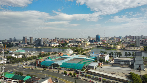 View of the panorama of the metropolis with the river and clouds