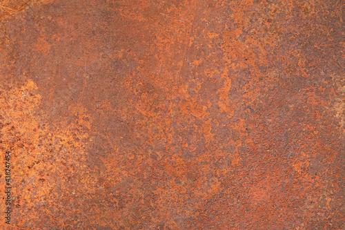 texture of an old metal surface coated with a layered orange rust. corrosion of metals caused by water.