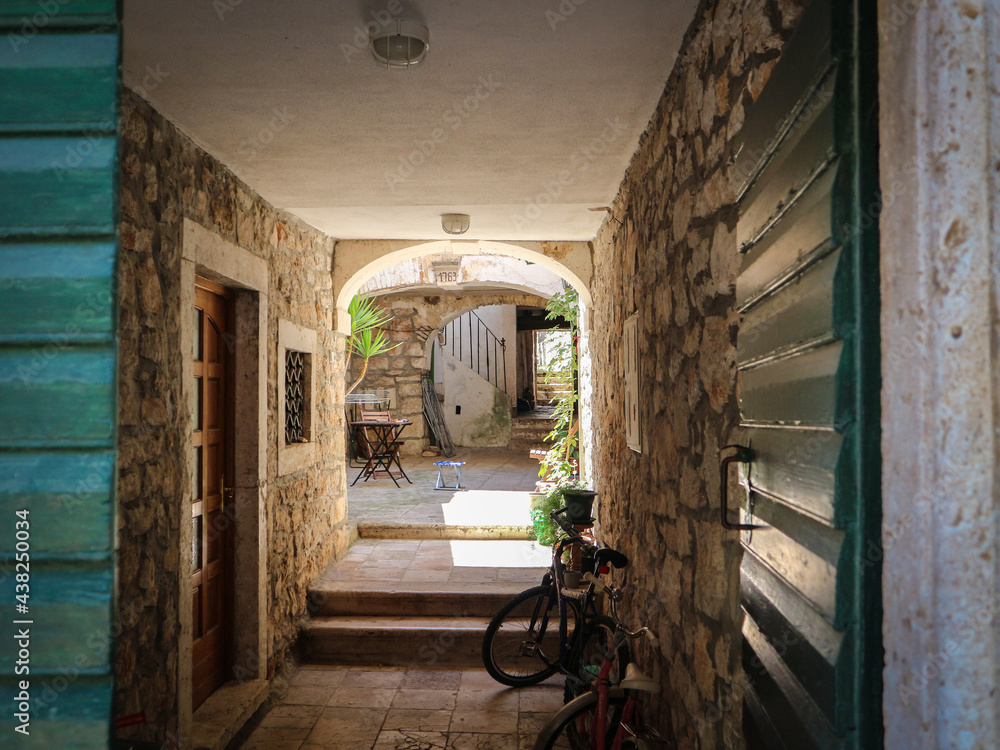 Beautiful, old, closed yard within the old town centre at Tisno, on Murter island, Croatia