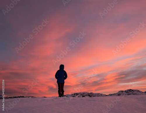 silhouette of a person on a mountain top