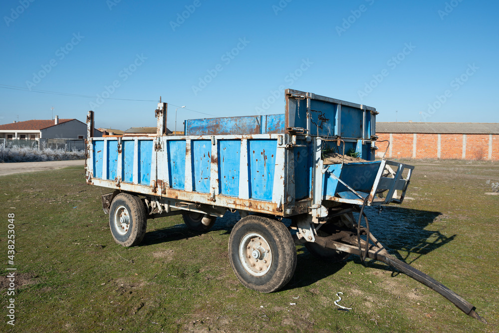 Blue wagon for the transport of grain and straw used intensively in a farm