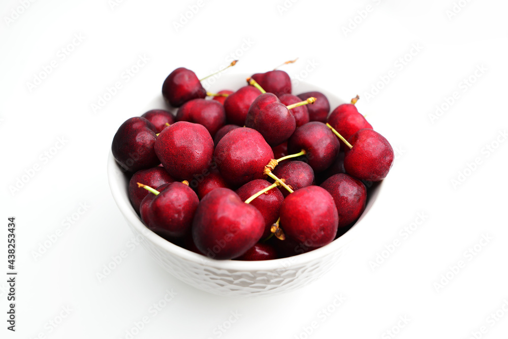 Cherries isolated on white background. Bowl of fresh cherries. Cherries isolated on white background. Bowl of fresh cherries.