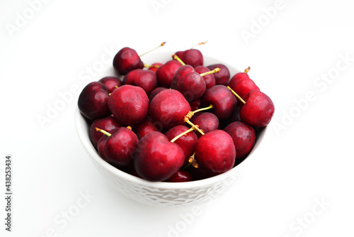 Cherries isolated on white background. Bowl of fresh cherries.