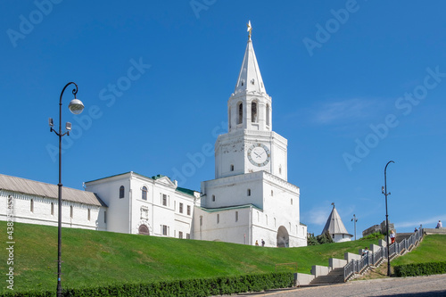 Kazan, Russia - May 19, 2021. View of the ancient historical Spasskaya tower and the wall of the Kazan Kremlin. Selective focus. © Olga Gubskaya