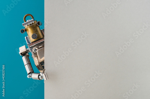 Portrait of a steampunk robot looking around the corner.