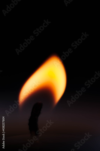 candle flame on black background hope religion 