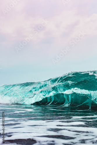 waves on the beach closeup background © chronisyan