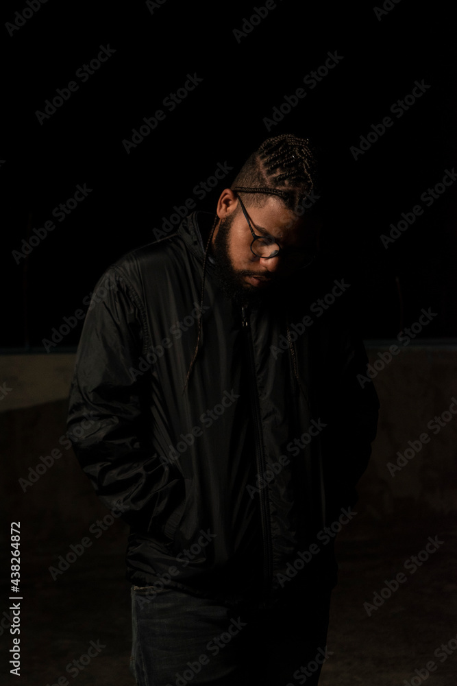 Fototapeta premium Lowkey photoshoot of a dominican men with african braids