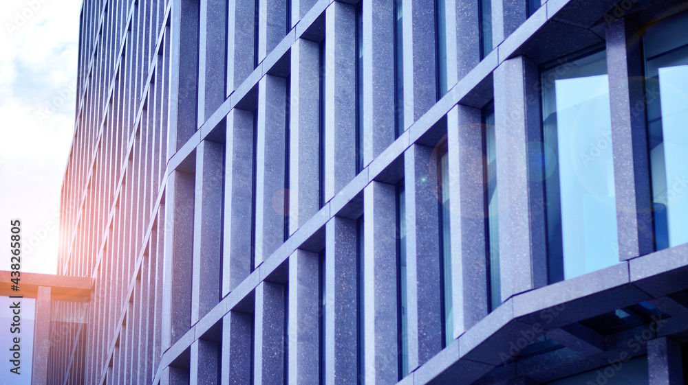 Abstract image of looking up at modern glass and concrete building. Architectural exterior detail of office building. Industrial art and detail. Sunrise. Abstract image of looking up at modern glass and concrete building. Architectural exterior detail of office building. Industrial art and detail. Sunrise.