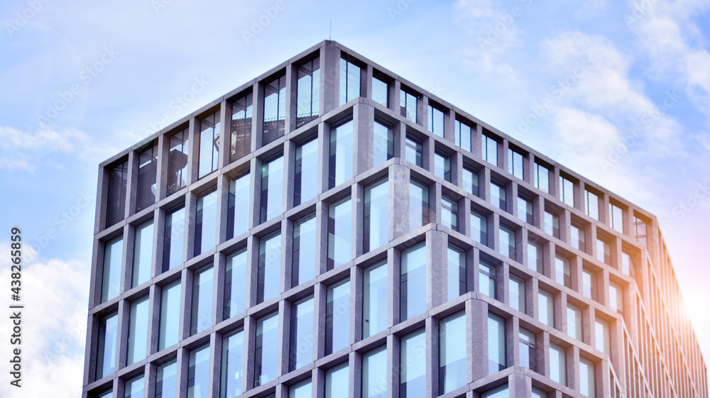 Abstract image of looking up at modern glass and concrete building. Architectural exterior detail of office building. Industrial art and detail. Sunrise. Abstract image of looking up at modern glass and concrete building. Architectural exterior detail of office building. Industrial art and detail. Sunrise.