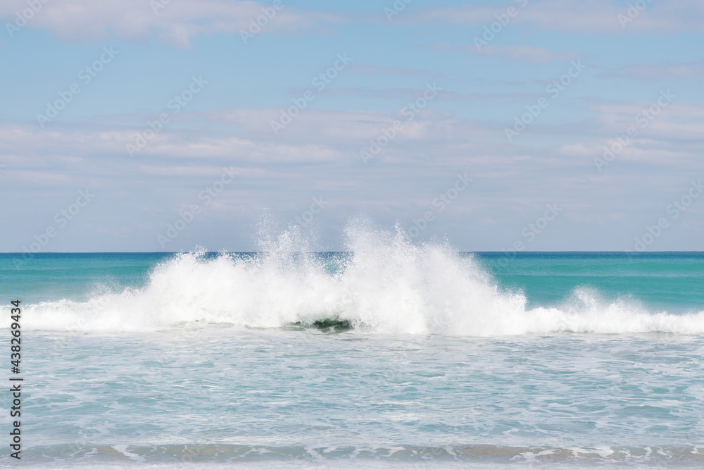 water splash seascape with blue sky over sea or ocean water, nature