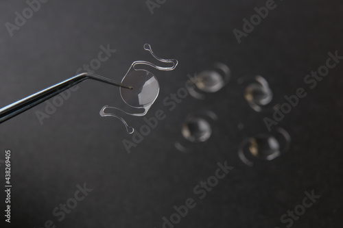 closeup photo of elastic intra ocular lens for cataract surgery