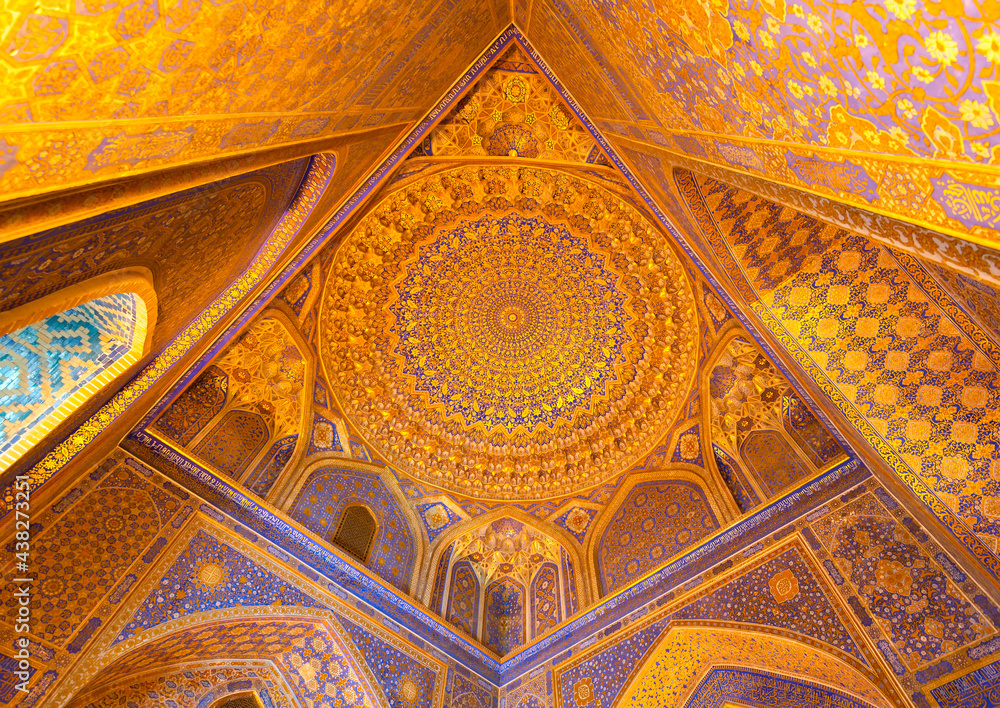 Interior of Tilya Kori Madrasah and Mosque in Registan Square in Samarkand, Uzbekistan. Geometrical decoration of gold applied by the method of kyndal