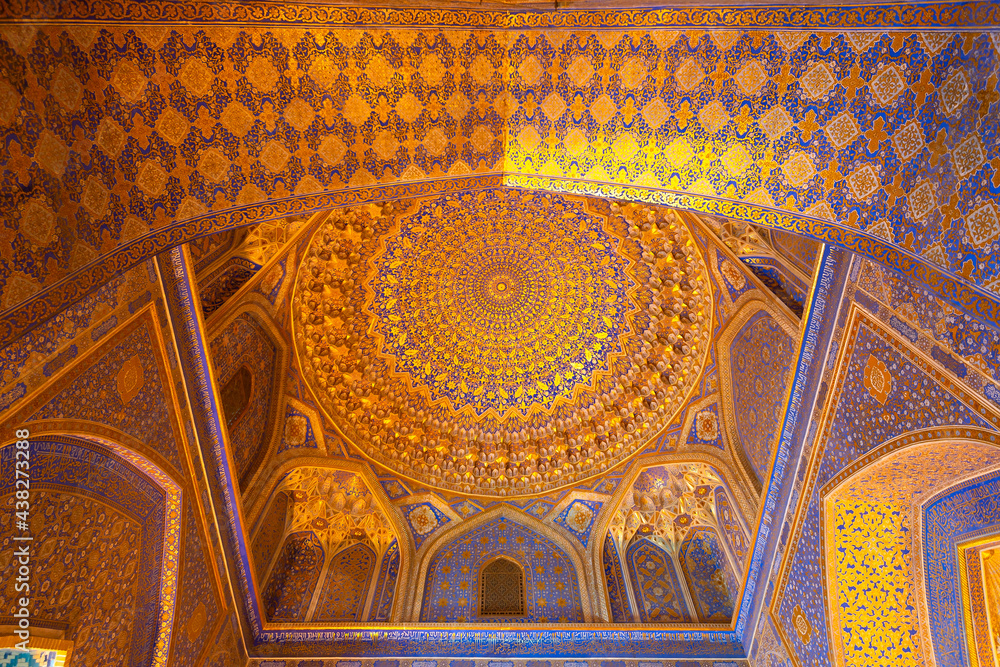 Interior of Tilya-Kori Madrasah and Mosque in Registan Square in Samarkand, Uzbekistan. Geometrical decoration of gold applied by the method of kyndal