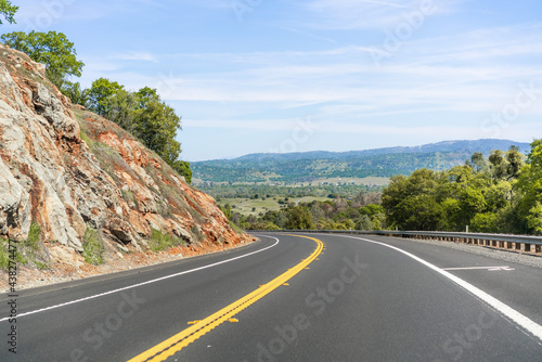 Empty highway going through the Sierra Foothills; Calaveras County, California photo