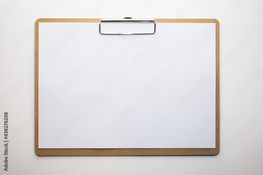 Horizontal clipboard with clean blank white paper. Isolated on pure