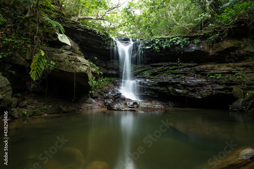 Kura waterfall with its serene atmosphere full of vegetation  refreshing swimming hole with smooth surface. Iriomote Island.