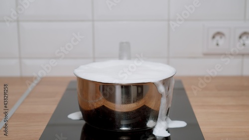 Milk Is Pouring Out To The Stove