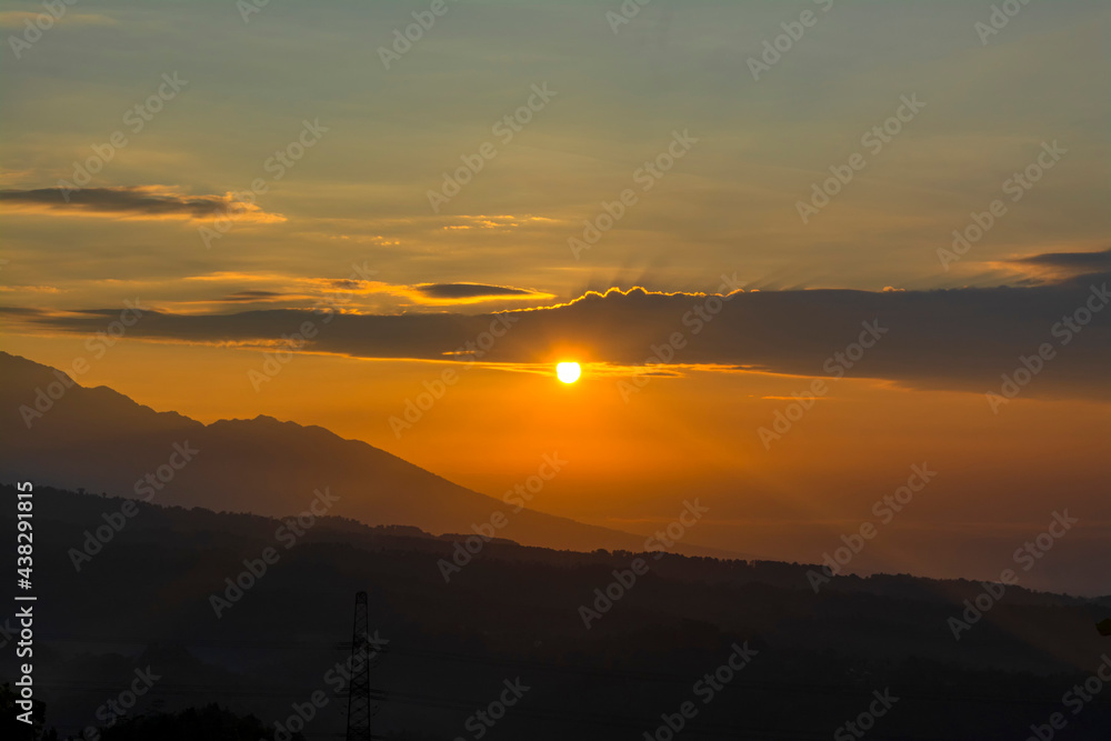 Sunrise over beautiful mountains in Indonesia. Majestic sunrise over the mountains