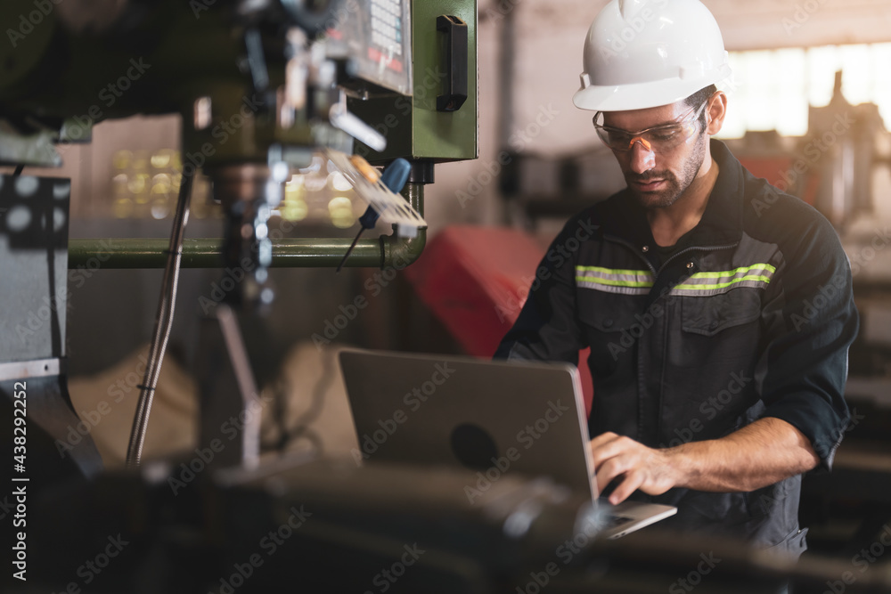 Mechanical engineer using the laptop computer and working for maintenance or repairing the machine in factory. Mechanical engineer using the laptop computer and working for maintenance or repairing the machine in factory.