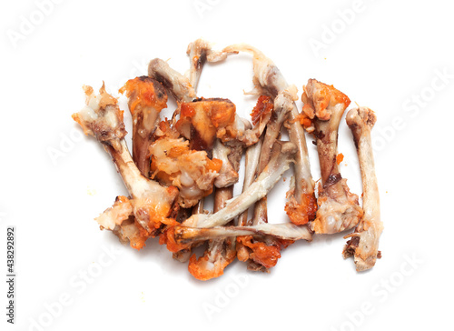 chicken bones gnawed after eating on a white background