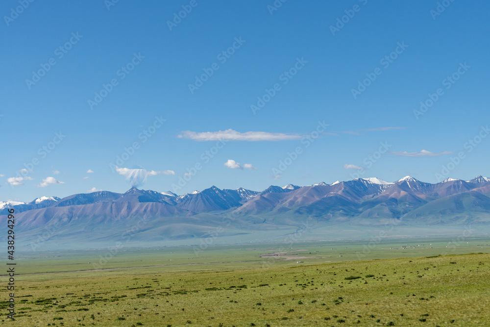 Mountains and grasslands along G217 highway in Xinjiang, China in summer