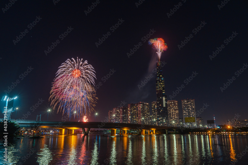 Multiple Colorful fireworks at Ho Chi Minh City celebrating Happy New Year 2020 moments. View from Sai Gon riverside