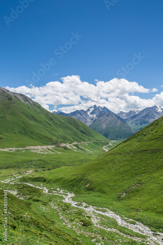 Fototapeta Naklejka Na Ścianę i Meble -  Mountains and grasslands along G217 highway in Xinjiang, China in summer
