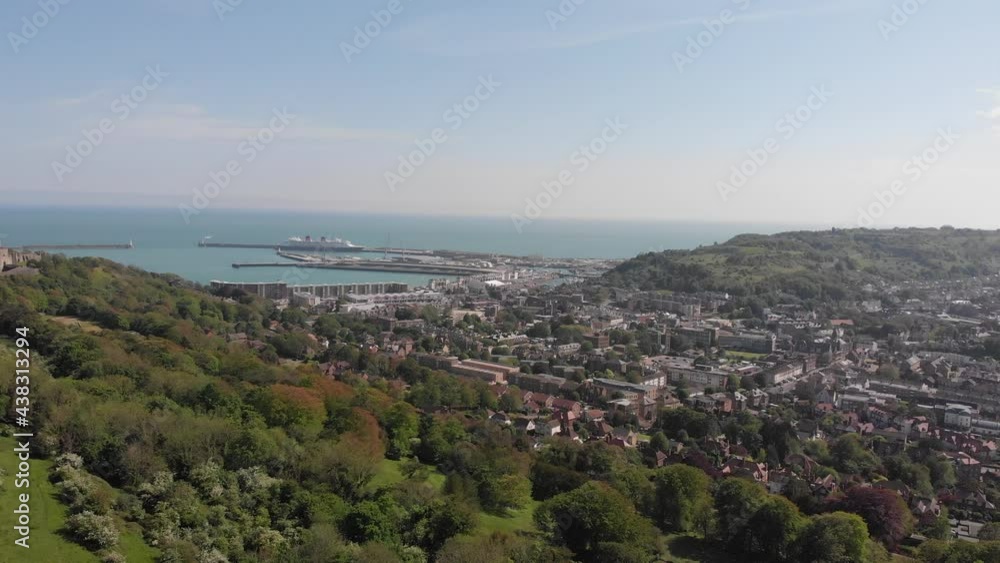 Left to right pan of Dover cast, Dover town and the ferry terminal on a suny day in southeast england Left to right pan of Dover cast, Dover town and the ferry terminal on a suny day in southeast england