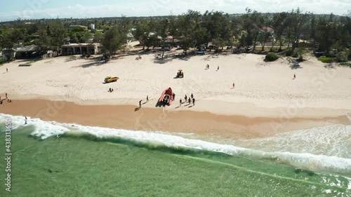 Aerial drone shot of a scuba boat on the sandy shores of Tofo, Mozambique. photo