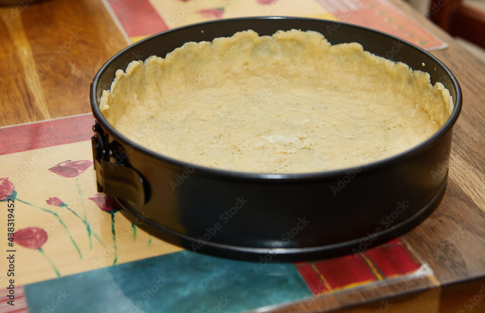 The form is lined with dough for making cheese pie, Step-by-step recipe from the Internet The form is lined with dough for making cheese pie, Step-by-step recipe from the Internet