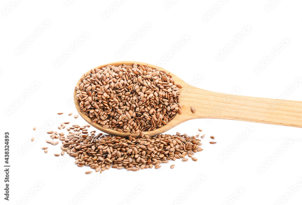 Spoon with flax seeds on white background Spoon with flax seeds on white background