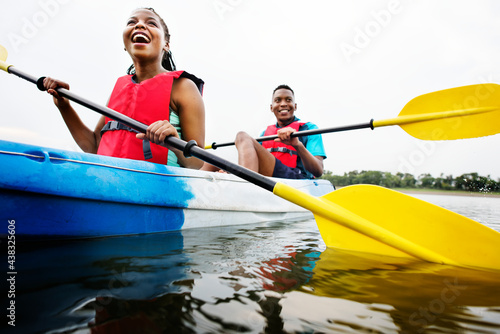 Couple canoeing in a lake photo