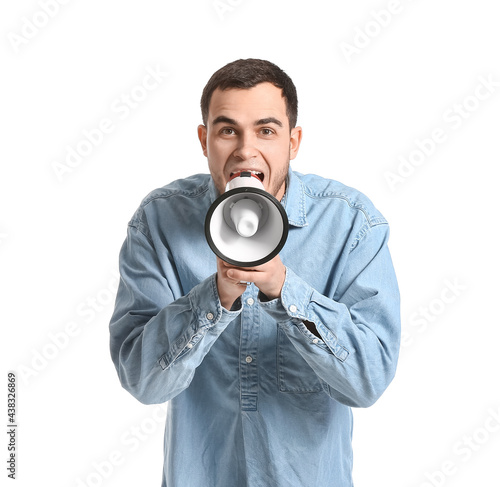 Handsome man shouting into ...