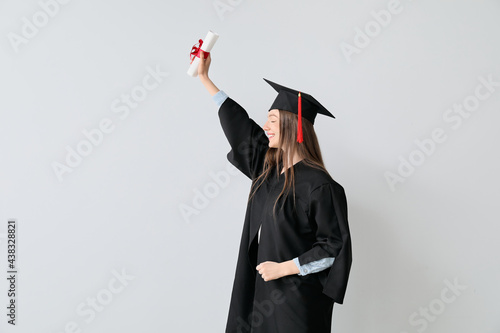 Happy female graduating stu...