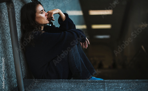 Woman Sitting Look Worried on The Stairway photo