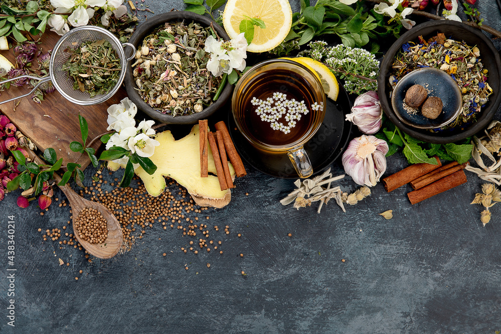 Various kinds of herbal tea on dark background. Natural herbs medicine.