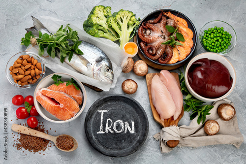 Food high in iron on light gray background. Healthy eating concept.
