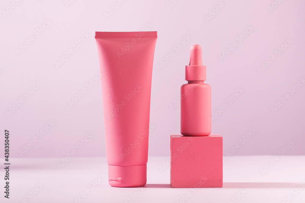 Mockup of pink containers for cosmetics, cream, serum, gel on a pink background. Copy space. Mockup of pink containers for cosmetics, cream, serum, gel on a pink background. Copy space.