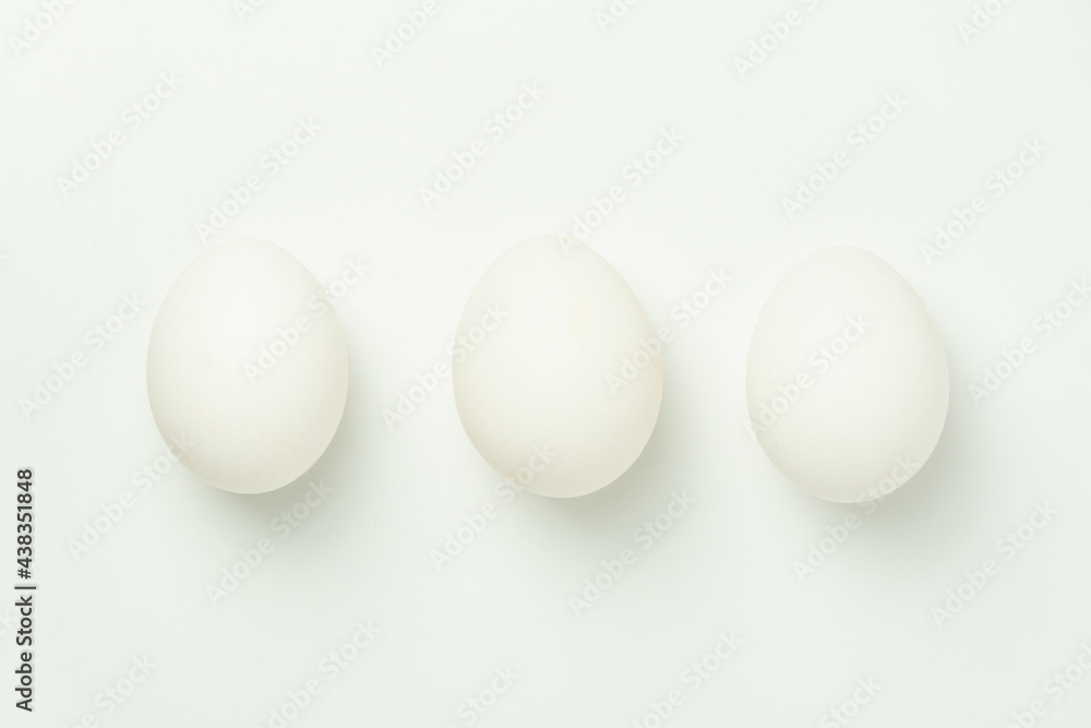 Three chicken eggs on a solid background Three chicken eggs on a solid background