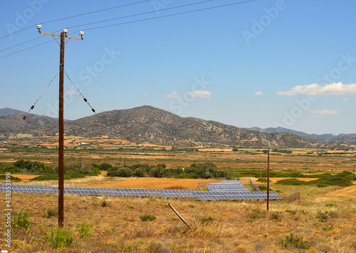 Solar energy panel and electricity wooden poles in southern Rhodes, Greece