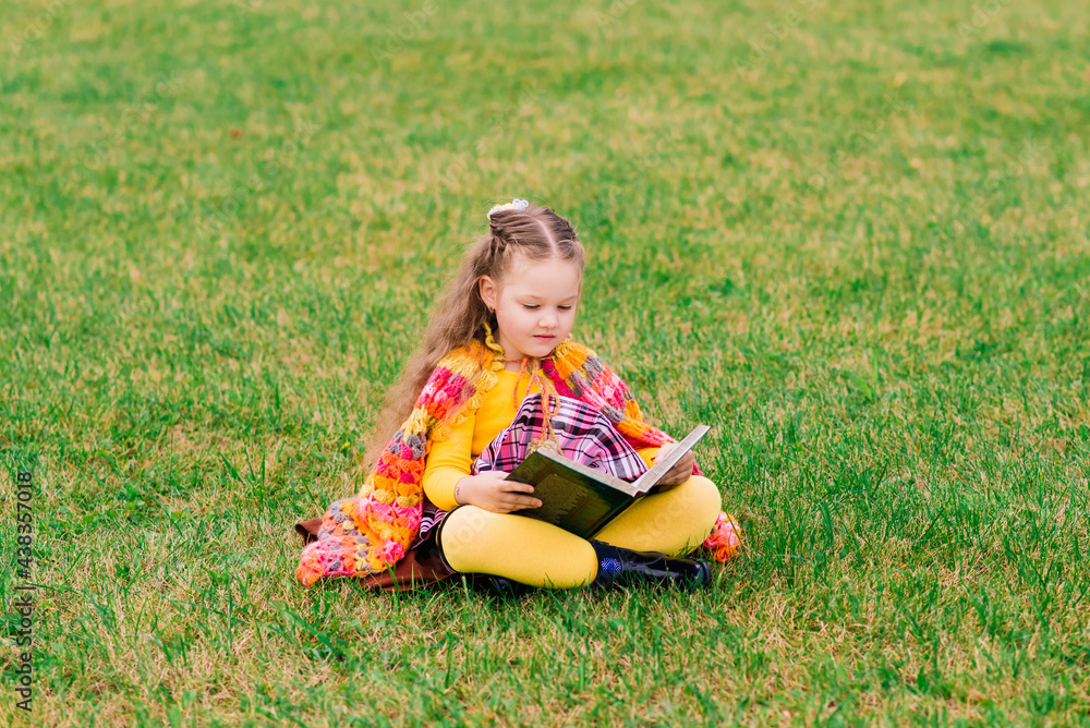 Adorable child girl at beautiful autumn park Adorable child girl at beautiful autumn park