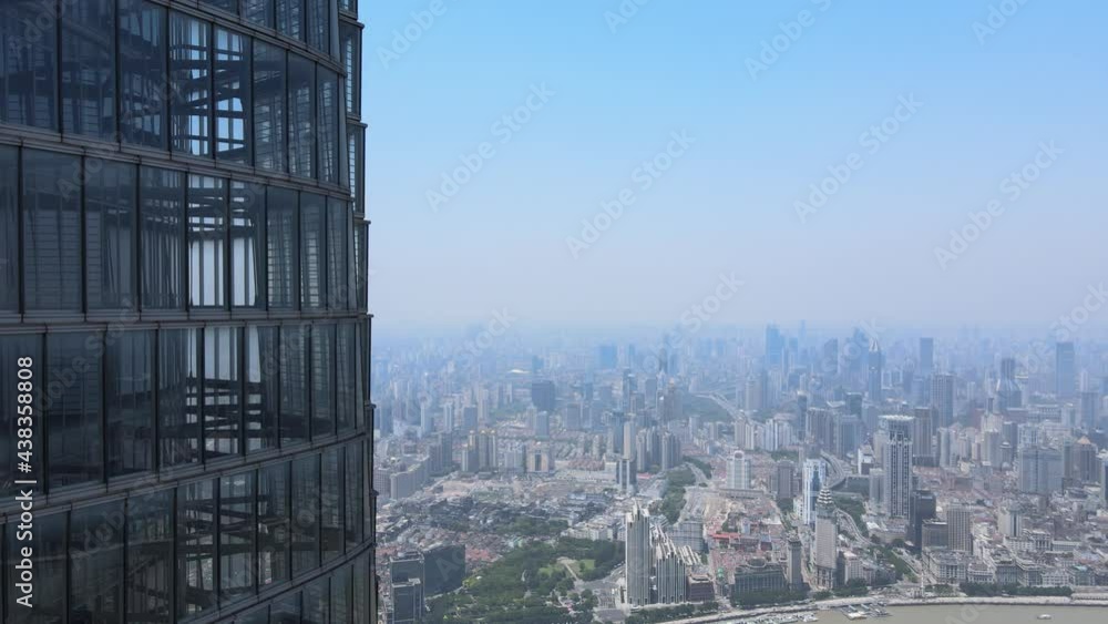 Drone aerial view of modern skyscraper and Shanghai downtown skyline. Epic closeup view of Lujiazui building. Business economy travel concept b-roll footage office building exterior with modern design Drone aerial view of modern skyscraper and Shanghai downtown skyline. Epic closeup view of Lujiazui building. Business economy travel concept b-roll footage office building exterior with modern design