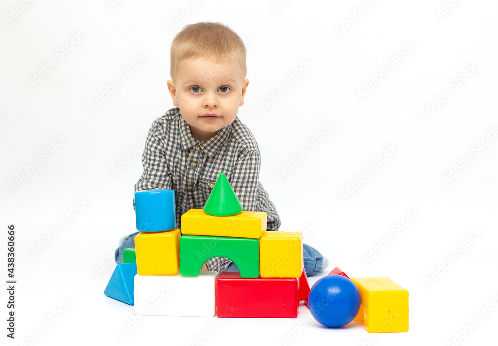 toddler child boy playing toy blocks isolated on white toddler child boy playing toy blocks isolated on white